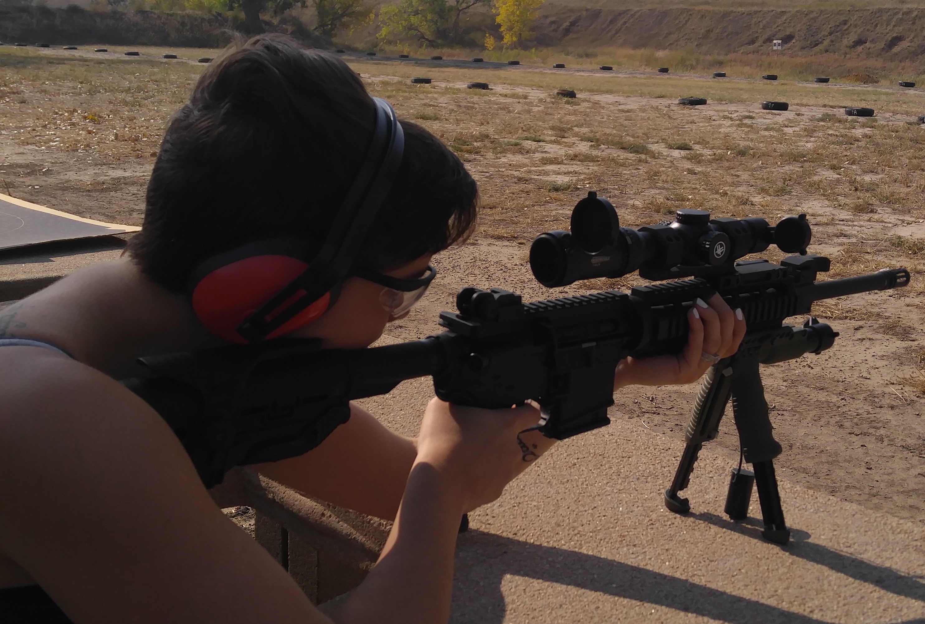 woman at firing range shooting