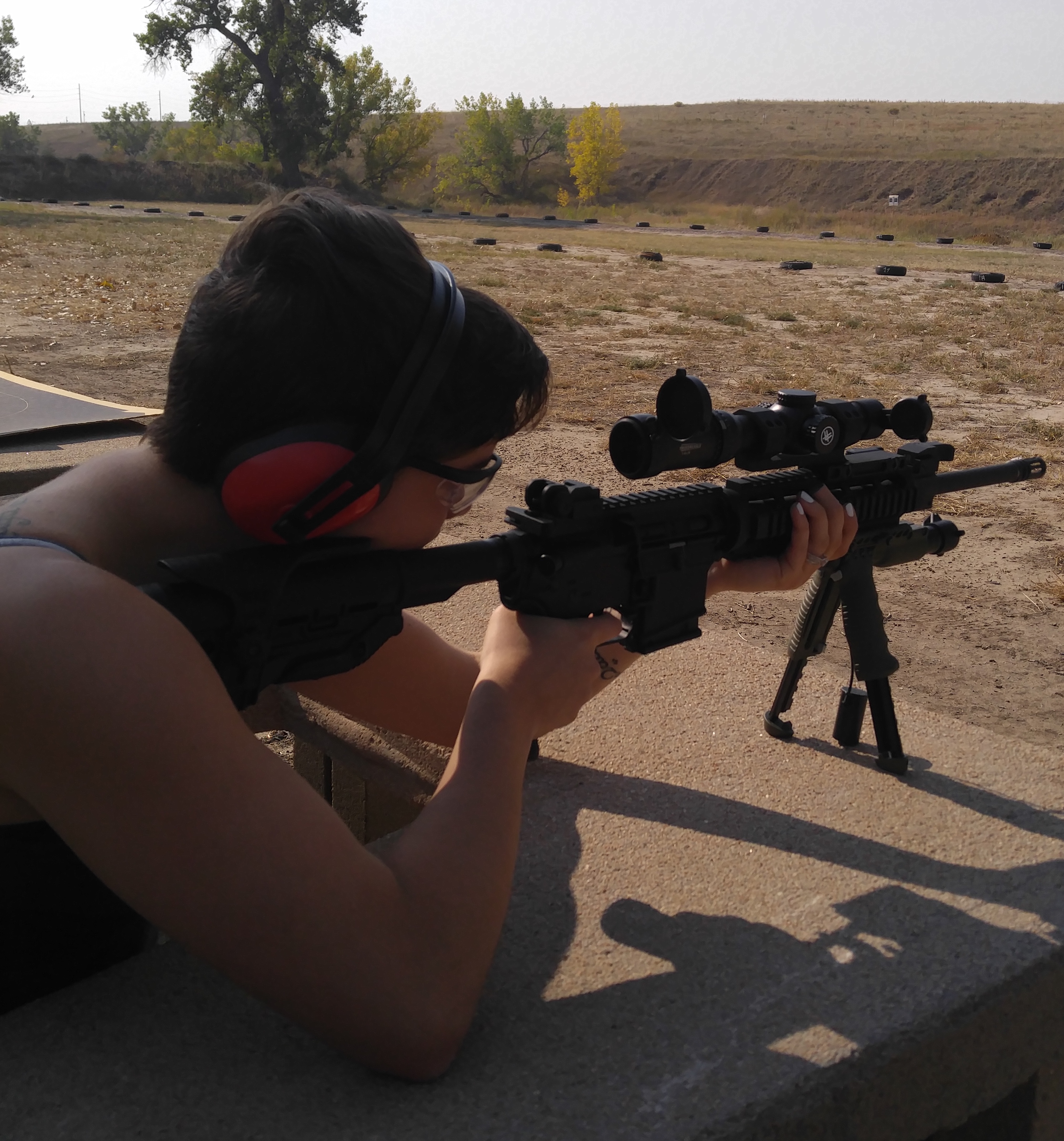 woman shooting at range